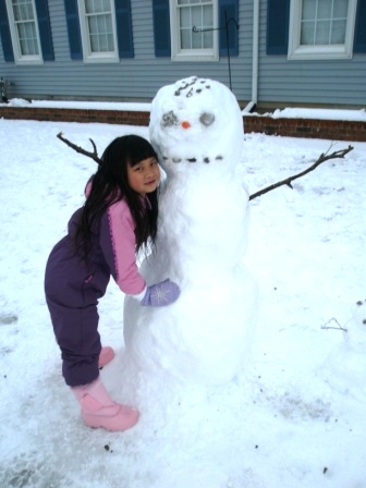 Kasen with the completed snowman